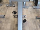an image of a row of stationary exercise bikes in a gym