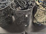 many wires and wires in buckets sitting on a table