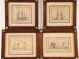 three framed drawings of ships on display in a wooden frame