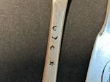 two spoons and a fork on a table