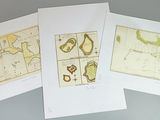 four cards with maps of the world on them on a table
