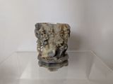 a vase that is sitting on a glass table