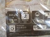 a picture of a package of bed linens on a bed