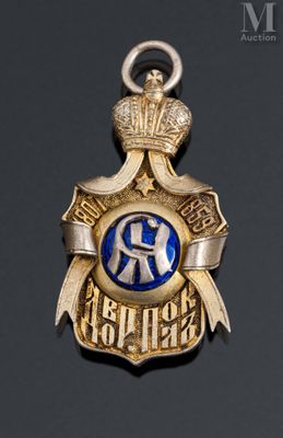 an image of a gold and blue badge with a crown on top