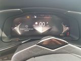 dashboard of a car with a digital clock on the display