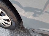 a close up of a car ' s tire on the street