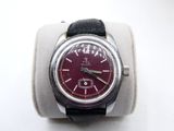 a watch that is sitting on top of a watch stand