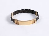 a close up of a bracelet on a white surface