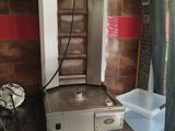 an image of a kitchen with a stove and a sink
