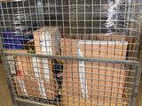 a metal cart with boxes in it in a warehouse