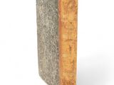 a close up of a book on a white surface with a white background