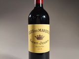 a bottle of wine that is sitting on a table