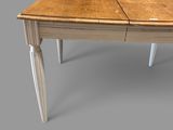 a wooden table with two legs and a table top