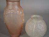 two vases sitting next to each other on a table