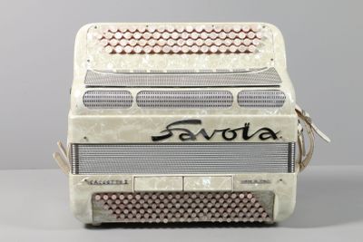 a white accordion sitting on top of a table