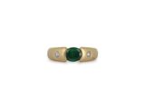 a close up of a gold ring with a green stone and diamonds