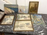 quatre tableaux posés sur une table, avec une photo représentant un voilier