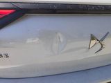 a close up of the rear end of a car with a star on it