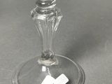 a wine glass that is sitting on top of a table