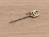 a small piece of jewelry on a wooden table