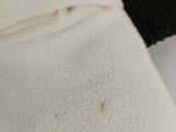 a close up of a stuffed animal with a black and white face