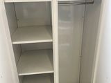 a white closet with shelves and shelves in it