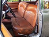 a brown leather seat in the back of a car