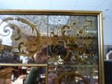 a person taking a picture of a mirror in a store
