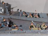a lot of toy soldiers on a toy ship