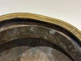 a close up of a metal bowl on a table