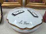 a picture of a porcelain box with two dominos on it