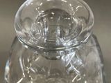 a clear glass jar with a lid on a table