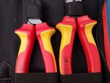 two pliers and a pair of pliers in a red case