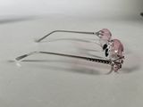 a pair of pink glasses sitting on a table