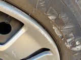a close up of a tire with a hole in the tire