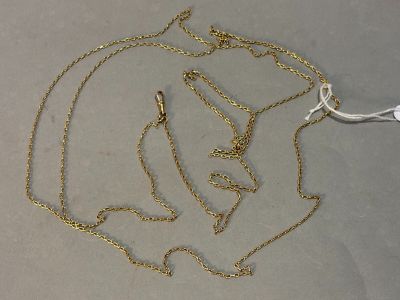 a gold necklace with the word love written on it