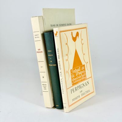 two books are stacked on top of each other on a white surface