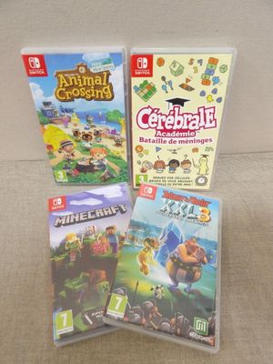 Trois jeux Nintendo Wii sont posés côte à côte sur un canapé