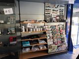 a display case with many items in it in a store