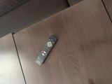 a remote control sitting on a table in a room