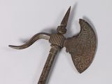 an old metal axe with a long handle on a white surface