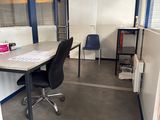 a room with a desk and a chair in it