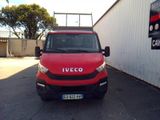 a red van parked in front of a white building