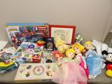 a lot of toys and books on a table