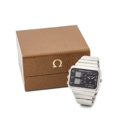 un gros plan sur une montre-bracelet avec une boîte en arrière-plan