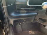 a view of a car ' s dashboard from the driver ' s seat