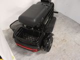 a scooter that is sitting in the corner of a room