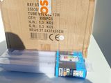 a box of ink sitting on top of a table next to a box of ink