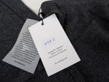 the label is attached to a sweater on a hanger