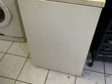 an image of a kitchen with a washer and dryer
